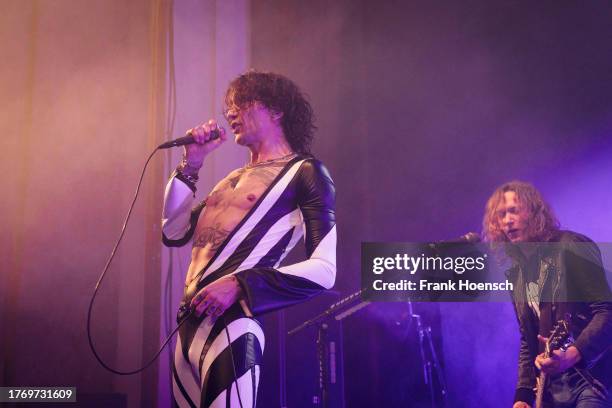 Justin Hawkins and Dan Hawkins of the British band The Darkness perform live on stage during a concert at the Admiralspalast on November 7, 2023 in...