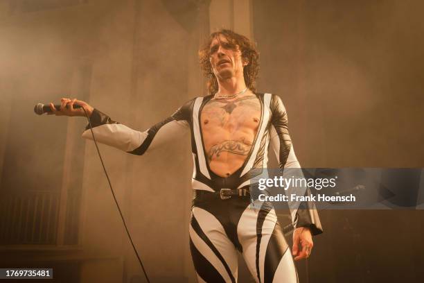 Singer Justin Hawkins of the British band The Darkness performs live on stage during a concert at the Admiralspalast on November 7, 2023 in Berlin,...