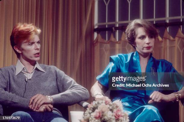 David Bowie and his wife Angela Bowie are interviewed on 'Good Morning America' by Rona Barrett in February, 1976 in Los Angeles, California.