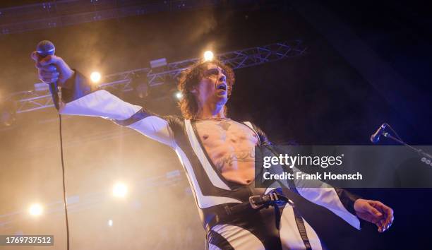 Singer Justin Hawkins of the British band The Darkness performs live on stage during a concert at the Admiralspalast on November 7, 2023 in Berlin,...