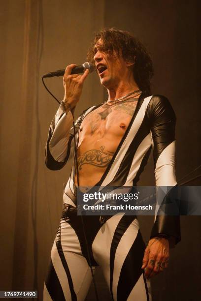 Singer Justin Hawkins of the British band The Darkness performs live on stage during a concert at the Admiralspalast on November 7, 2023 in Berlin,...