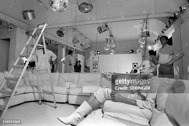 Photo taken on July 17, 1973 shows French fashion designer Andre Courreges preparing a collection, in his atelier in Paris. AFP PHOTO