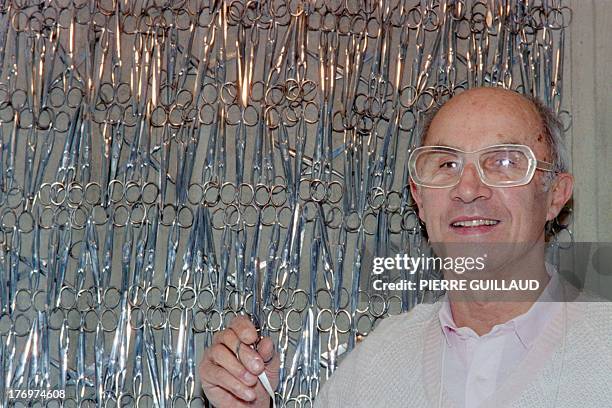 Photo taken on March 1, 1987 shows French fashion designer Andre Courreges, in his atelier in Paris. AFP PHOTO PIERRE GUILLAUD