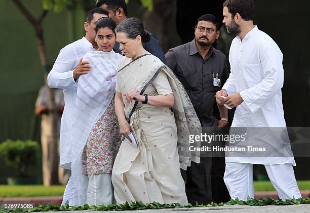 Sonia Gandhi with her granddaughter Miraya Vadra after paying tribute to former Indian Prime Minister Rajiv Gandhi on his birth anniversary at his...