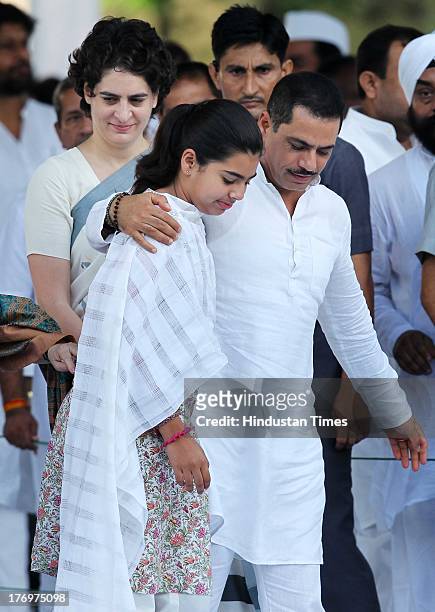 Priyanka and Robert Vadra with their daughter Miraya Vadra after paying tribute to former Indian Prime Minister Rajiv Gandhi on his birth anniversary...