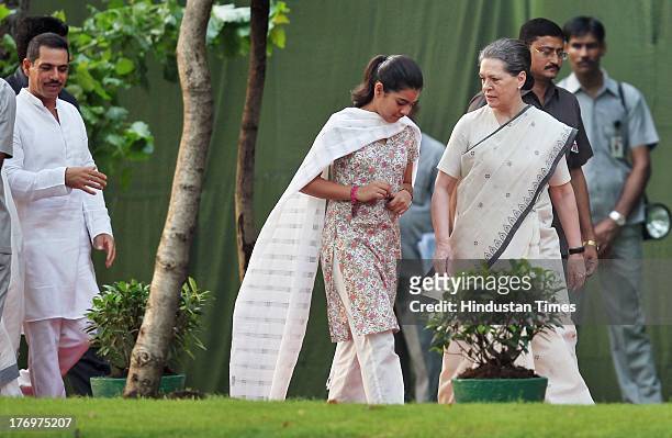 Sonia Gandhi with her granddaughter Miraya Vadra after paying tribute to former Indian Prime Minister Rajiv Gandhi on his birth anniversary at his...