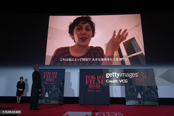 Iranian-French actress Zar Amir Ebrahimi is seen on a screen after winning the Award for the Best Actress during the closing ceremony of the 36th...