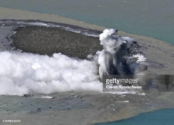 Photo taken from a Kyodo News plane on Oct. 30 shows plumes rising from the waters off the Iwoto Island, previously known as Iwojima, in the Pacific...