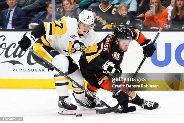 Ryan Graves of the Pittsburgh Penguins and Mason McTavish of the Anaheim Ducks battle for position during the first period at Honda Center on...