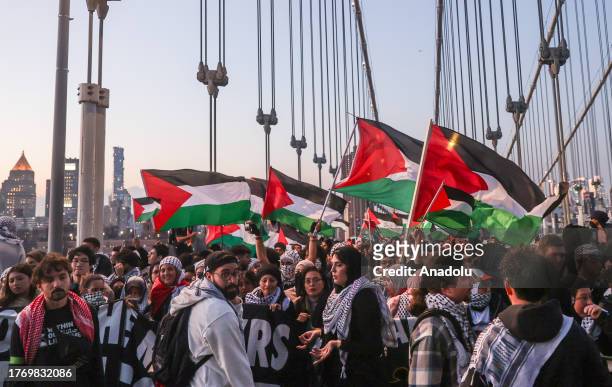 Pro-Palestinian demonstrators take to the streets on Tuesday night and march from Manhattan to Brooklyn over Manhattan Bridge, in New York, United...