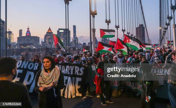 Pro-Palestinian demonstrators take to the streets on Tuesday night and march from Manhattan to Brooklyn over Manhattan Bridge, in New York, United...