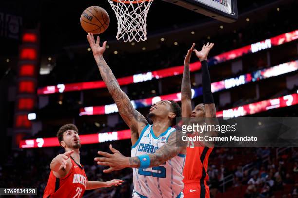 Washington of the Charlotte Hornets drives to the net ahead of Jabari Smith Jr. #10 of the Houston Rockets during the second half at Toyota Center on...