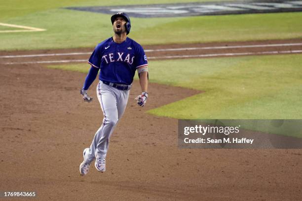 Marcus Semien of the Texas Rangers rounds the bases after hitting a home run in the ninth inning against the Arizona Diamondbacks during Game Five of...