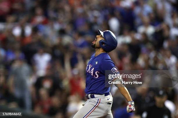 Marcus Semien of the Texas Rangers rounds the bases after hitting a home run in the ninth inning against the Arizona Diamondbacks during Game Five of...