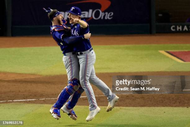Jonah Heim and Josh Sborz of the Texas Rangers celebrate after beating the Arizona Diamondbacks 5-0 in Game Five to win the World Series at Chase...