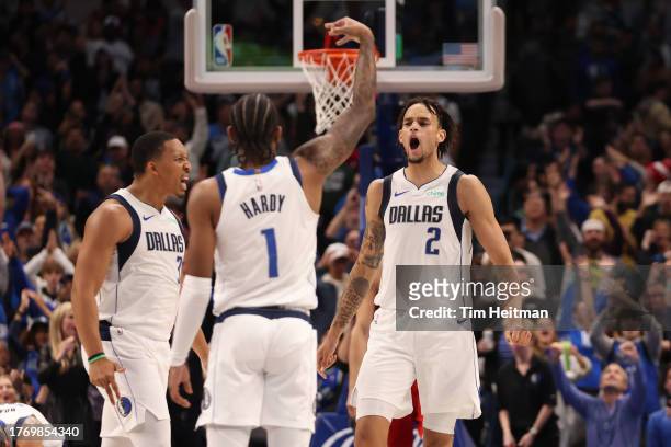 Grant Williams, Jaden Hardy and Dereck Lively II of the Dallas Mavericks celebrate a basket in the second half against the Chicago Bulls at American...