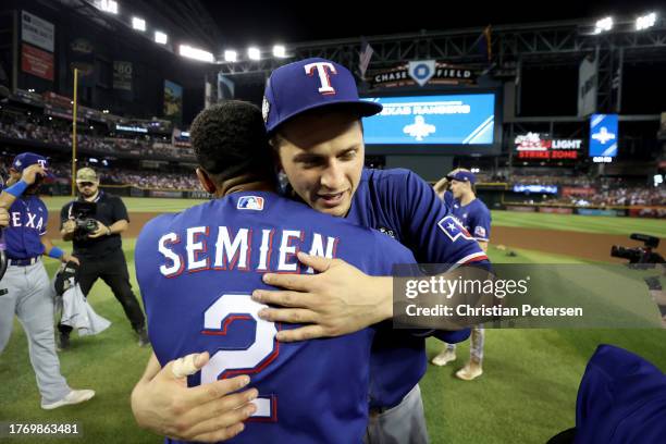 Marcus Semien and Corey Seager of the Texas Rangers celebrate after beating the Arizona Diamondbacks 5-0 in Game Five to win the World Series at...