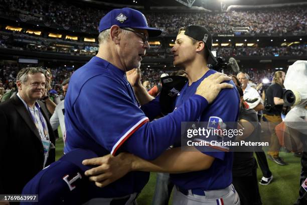 Manager Bruce Bochy and Corey Seager of the Texas Rangers celebrate after the Texas Rangers beat the Arizona Diamondbacks 5-0 in Game Five to win the...