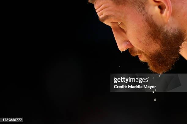 Sweat drips off the face of Svi Mykhailiuk of the Boston Celtics during the second half of the game against the Indiana Pacers at TD Garden on...