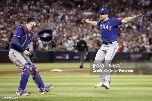 Jonah Heim and Josh Sborz of the Texas Rangers celebrate after beating the Arizona Diamondbacks 5-0 in Game Five to win the World Series at Chase...