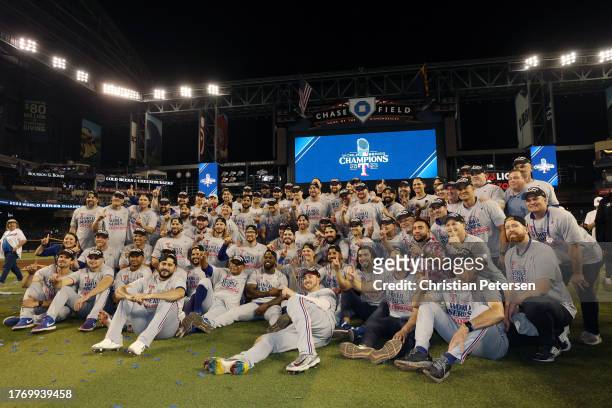 The Texas Rangers pose for photos after beating the Arizona Diamondbacks 5-0 in Game Five to win the World Series at Chase Field on November 01, 2023...