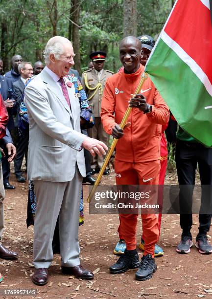 King Charles III with Kenyan marathon runner Eliud Kipchoge, as they flag off to start a 15km "Run for Nature" event during a visit to Karura urban...