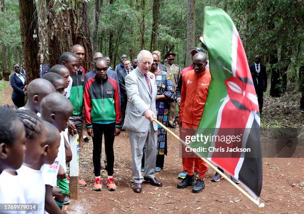 King Charles III with Kenyan marathon runner Eliud Kipchoge, as they flag off to start a 15km "Run for Nature" event during a visit to Karura urban...
