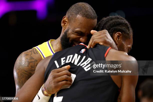 LeBron James of the Los Angeles Lakers hugs Kawhi Leonard of the Los Angeles Clippers after the 130-125 overtime win at Crypto.com Arena on November...