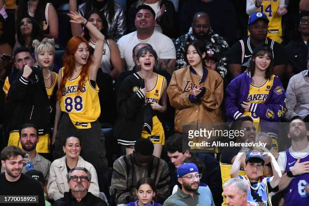 Hong Eun-chae, Huh Yun-jin, Kazuha Nakamura, Sakura Miyawaki and Kim Chae-won and of LE SSERAFIM attend a basketball game between the Los Angeles...