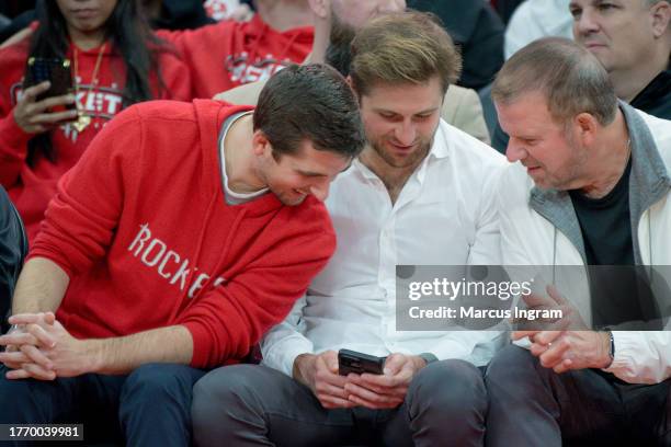 Blake Fertitta, Patrick Fertitta, and Houston Rockets owner Tilman Fertitta attend the game between the Houston Rockets and Charlotte Hornets at...