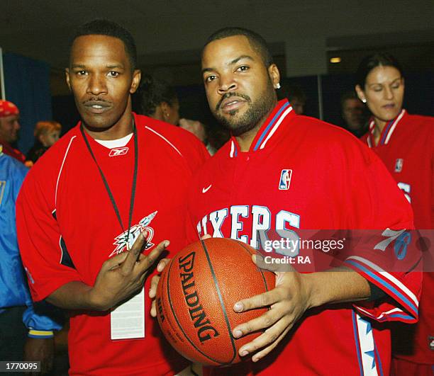 Actors Jamie Foxx and Ice Cube pose prior to the Celebrity Game at the NBA Jam Session at the Georgia World Congress Center on February 7,2003 in...