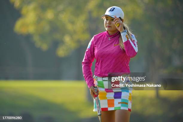 Shiho Kuwaki of Japan acknowledges the gallery after holing out on the 9th green during the first round of the TOTO Japan Classic at the Taiheiyo...