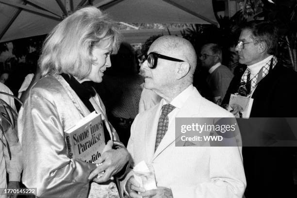 Angie Dickinson, Irving "Swifty" Lazar, and Roddy McDowall attend a party in Beverly Hills, California, on June 25, 1987.