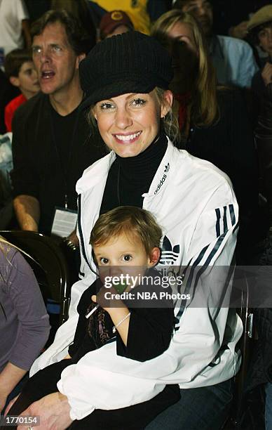 Musician Faith Hill and her daughter Audrey Caroline watch the Celebrity Game at NBA Jam Session during the 2003 NBA All Star Weekend at the Georgia...