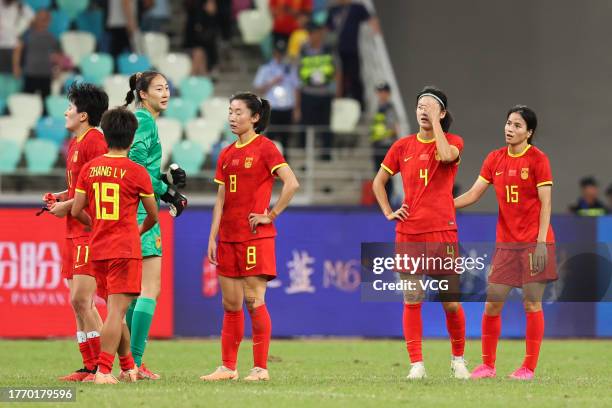 Players of China react after the AFC Women's Asian Olympic Qualifier Round 2 Group B match between China and South Korea at Xiamen Egret Stadium on...