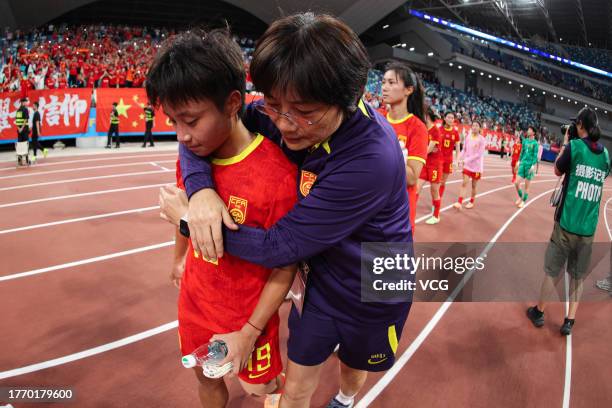 Head coach Shui Qingxia of China consoles Zhang Linyan after the AFC Women's Asian Olympic Qualifier Round 2 Group B match between China and South...