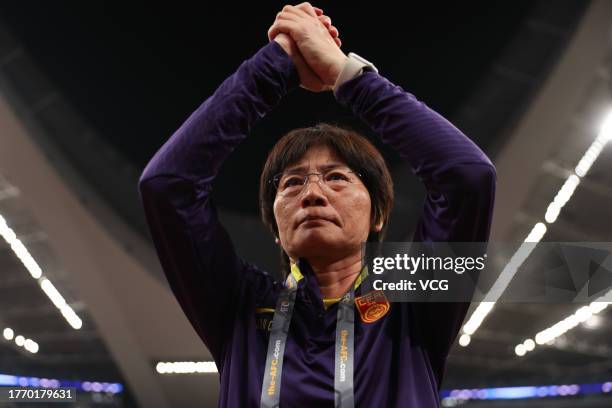 Head coach Shui Qingxia of China thanks fans after the AFC Women's Asian Olympic Qualifier Round 2 Group B match between China and South Korea at...