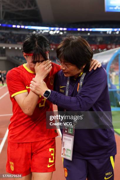 Head coach Shui Qingxia of China consoles Dou Jiaxing after the AFC Women's Asian Olympic Qualifier Round 2 Group B match between China and South...