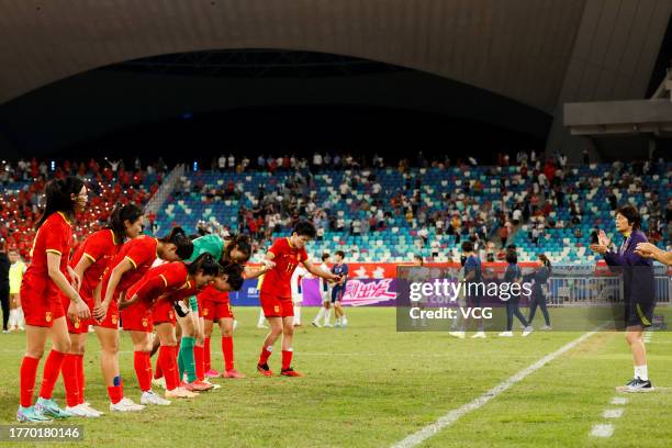 Players of China thank their coach Shui Qingxia after the AFC Women's Asian Olympic Qualifier Round 2 Group B match between China and South Korea at...