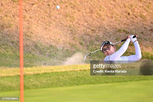 Sakura Yokomine of Japan hits out from a bunker on the 18th hole during the first round of Meiji Yasuda Ladies Open Golf Tournament at Ibaraki...