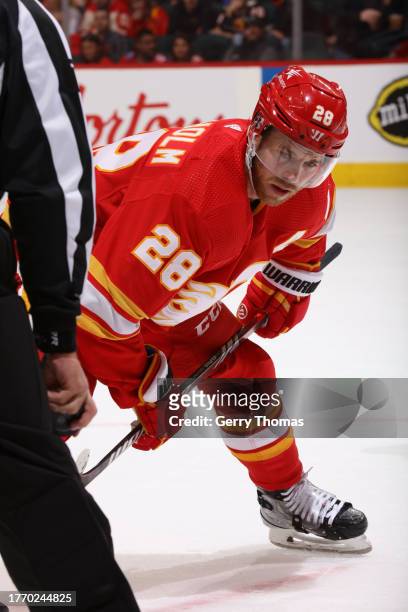 Elias Lindholm of the Calgary Flames prepares for a face off against the Nashville Predators at Scotiabank Saddledome on November 7, 2023 in Calgary,...