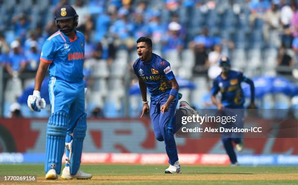 Dilshan Madushanka of Sri Lanka celebrates the wicket of Rohit Sharma of India during the ICC Men's Cricket World Cup India 2023 between India and...