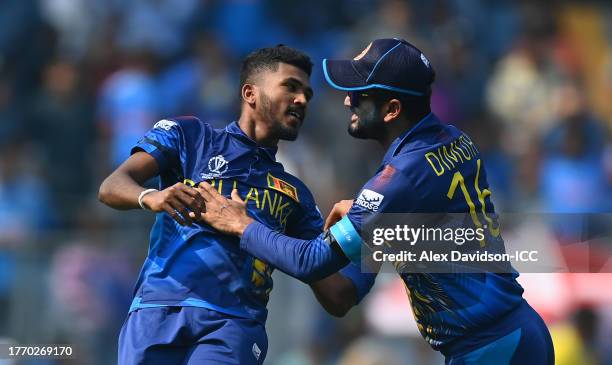 Dilshan Madushanka of Sri Lanka celebrates the wicket of Rohit Sharma of India during the ICC Men's Cricket World Cup India 2023 between India and...