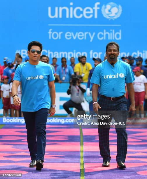 Sachin Tendulkar and Muttiah Muralitharan make their way out for the National Anthems ahead of the ICC Men's Cricket World Cup India 2023 between...