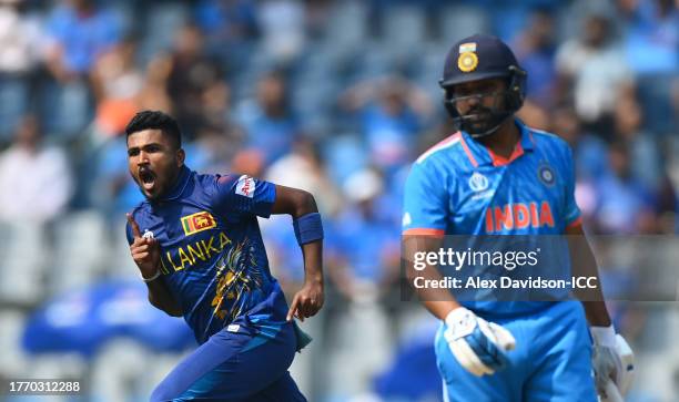 Dilshan Madushanka of Sri Lanka celebrates the wicket of Rohit Sharma of India during the ICC Men's Cricket World Cup India 2023 between India and...