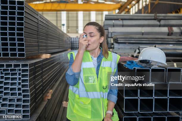 industrial engineer with asthma inhaler - respiratory protection construction stock pictures, royalty-free photos & images