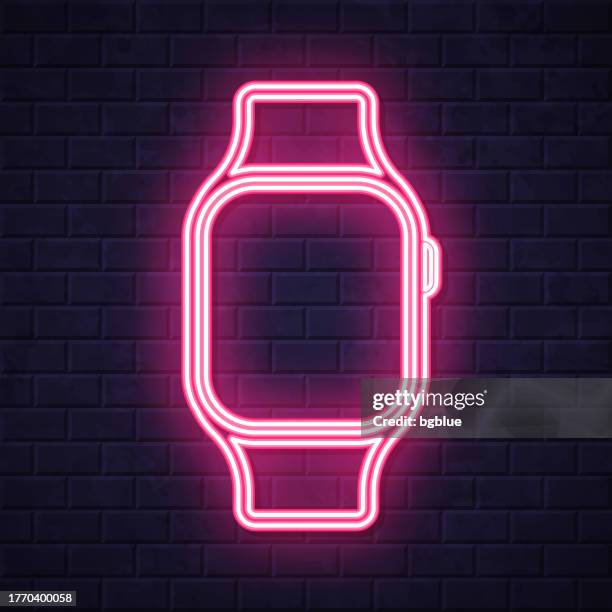 smartwatch. glowing neon icon on brick wall background - touch screen wall stock illustrations
