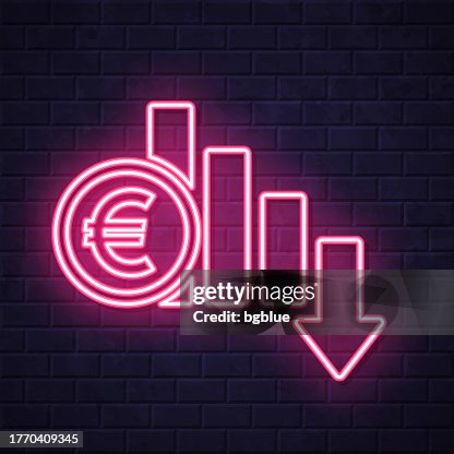 Euro rate decrease. Glowing neon icon on brick wall background Euro rate decrease. Glowing neon icon on brick wall background