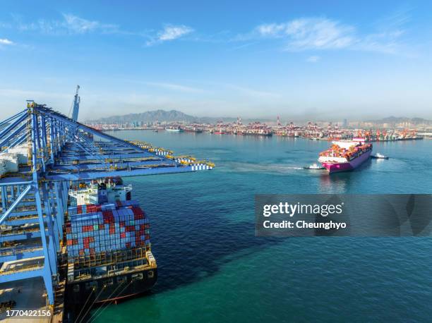 drone point view of loading dock in qingdao qianwan container terminal. east china's shandong province - point stock photos et images de collection