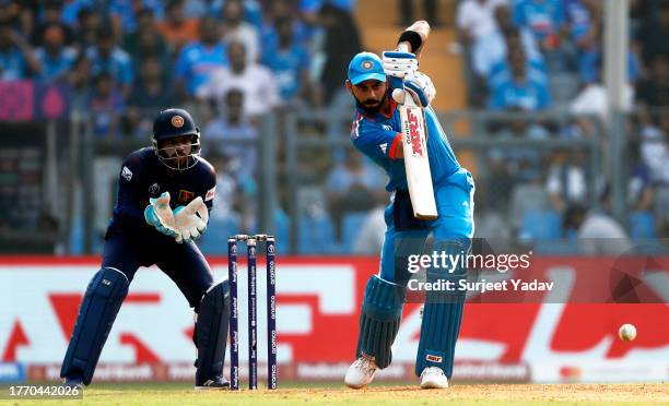 Virat Kohli of India plays a shot as Kusal Mendis of Sri Lanka keeps during the ICC Men's Cricket World Cup India 2023 between India and Sri Lanka at...